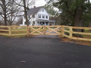 3 rail paddock style fence with driveway gate. all pressure treated.