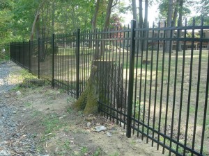 72 inch high 4 rail aluminum fence custom cut around existing stump style belmont