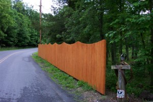 White cedar dog eared milled stockade style privacy fence with custom stain.(customer applied)