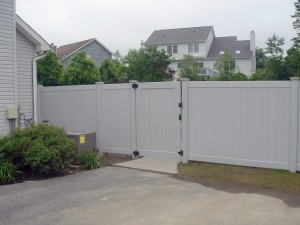 v300 4' swing gate installed in gray privacy fence with new england post caps